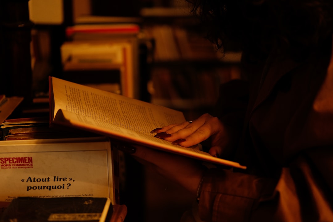 person journaling in cozy room with natural light and notebook
